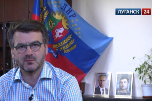 Заметна преемственность с прежним гербом "ЛНР" и гербом Луганской области